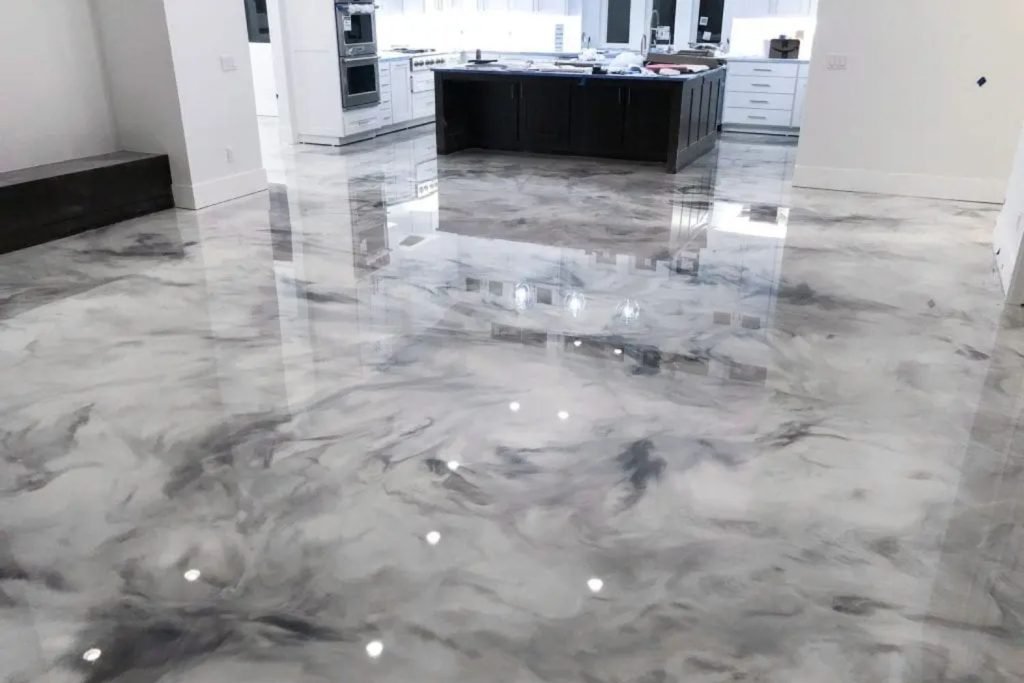 A stylish marble floor in a modern kitchen, representing epoxy flooring services offered in San Jose, CA.