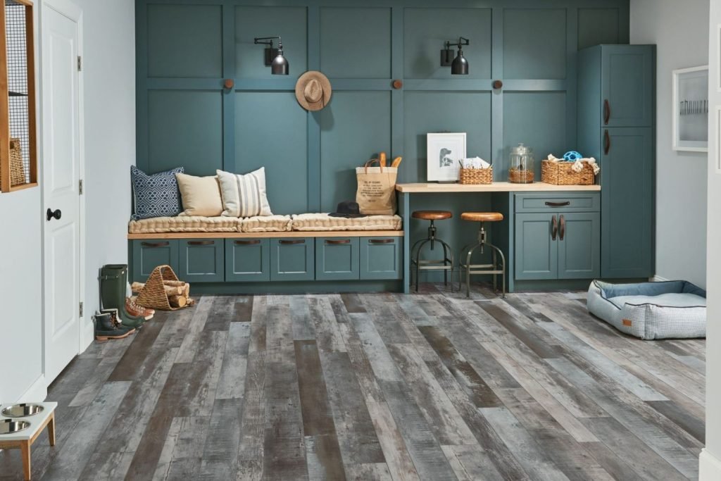 A stylish room with blue walls and wood flooring, representing luxury vinyl tile flooring services in San Jose, CA.