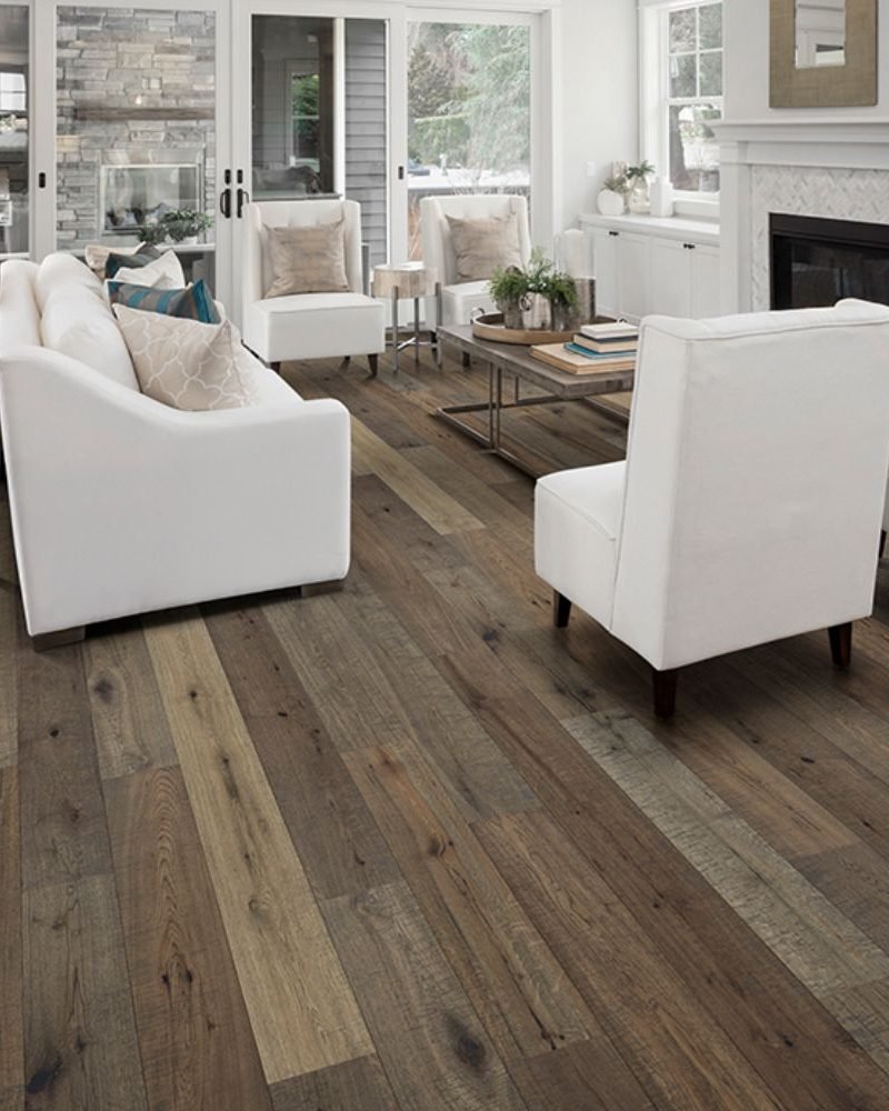 Professional Flooring Repair and Refinishing Services in San Jose, CA A bright living room with wood floors and white furniture, reflecting a clean and modern style in San Jose, CA.