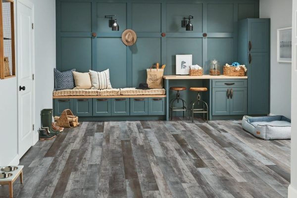 A stylish room with blue walls and wood flooring, representing luxury vinyl tile flooring services in San Jose, CA.
